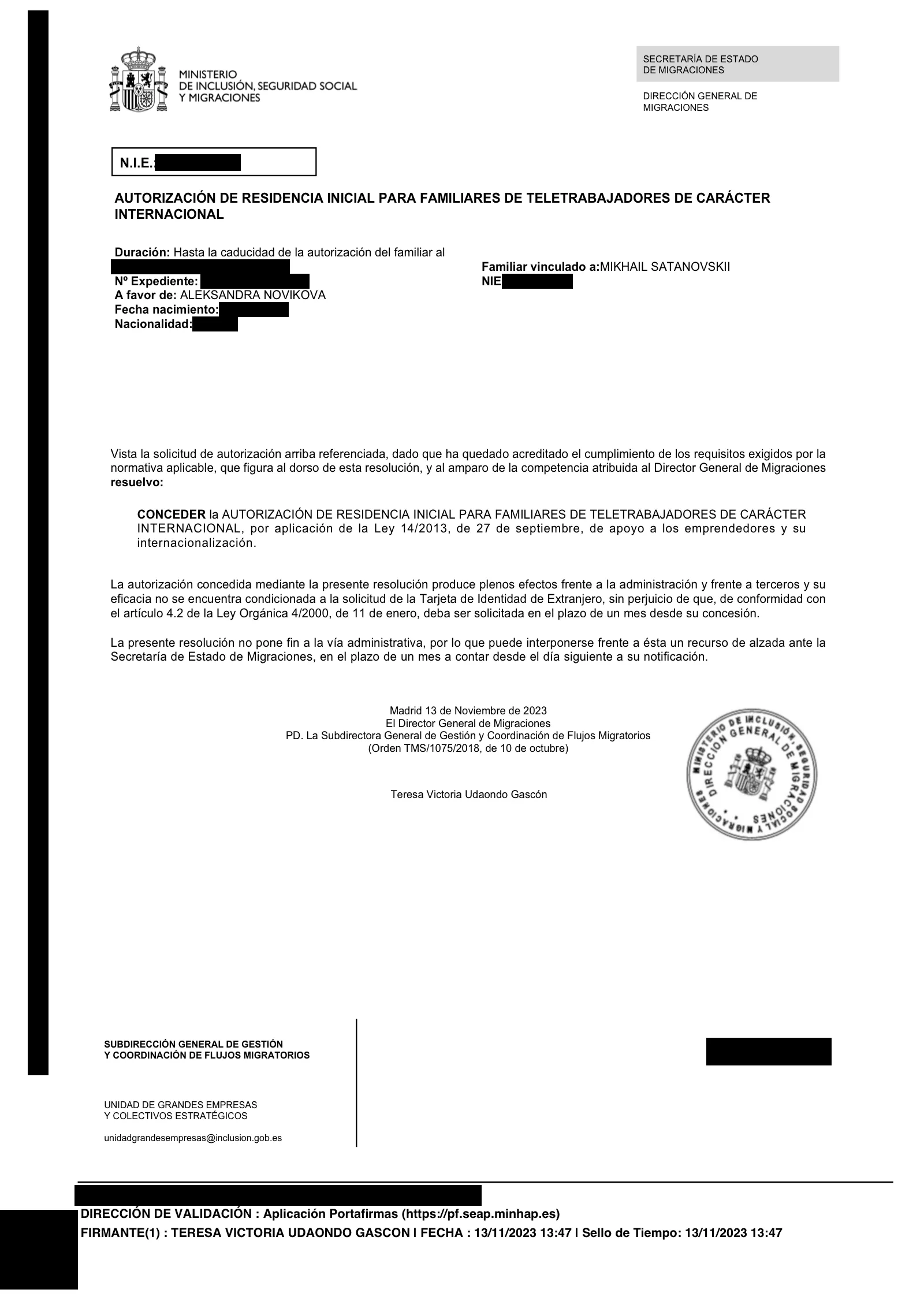 A UGE approval for a family member 2 — personal data covered with opaque plaques